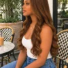 The Golden Belle 24-inch 4/27 bouncing curls wig, side view on a model.