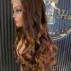 The Golden Belle 24-inch 4/27 bouncing curls wig, side view on a mannequin.