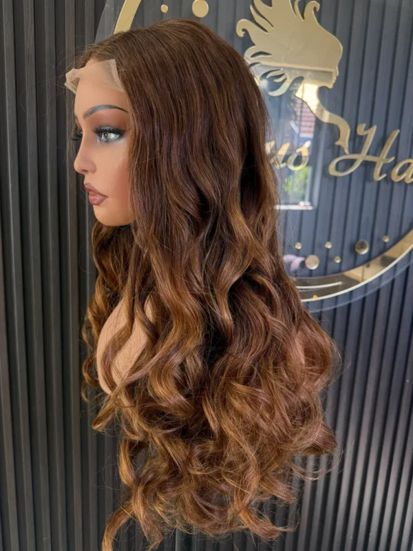 The Golden Belle 24-inch 4/27 bouncing curls wig, side view on a mannequin.
