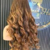 The Golden Belle 24-inch 4/27 bouncing curls wig, rear view on a mannequin.